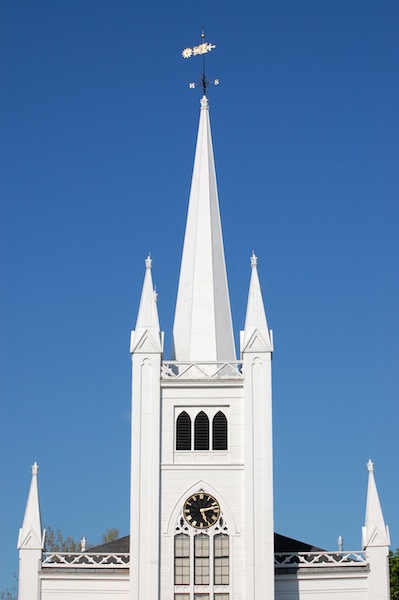 white church steeple against blue sky